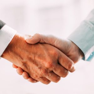 Close-up of business partners shaking hands