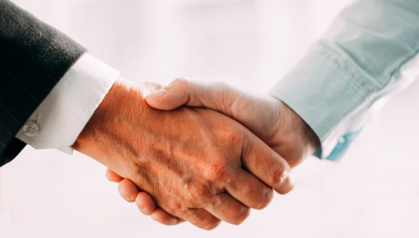 Close-up of business partners shaking hands