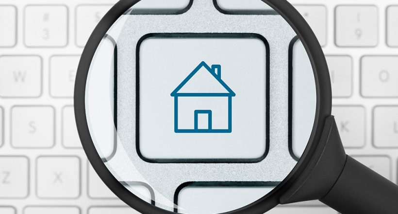 House icon under the magnifying glass