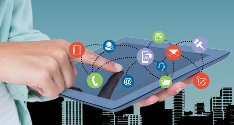 Composite image of hand touching digital tablet with graphics icons