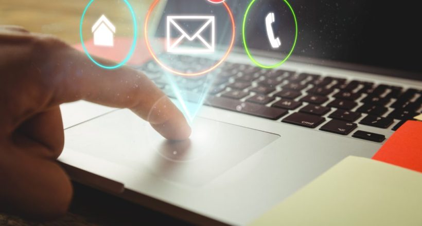 Digital composite of New mails appearing beside laptop